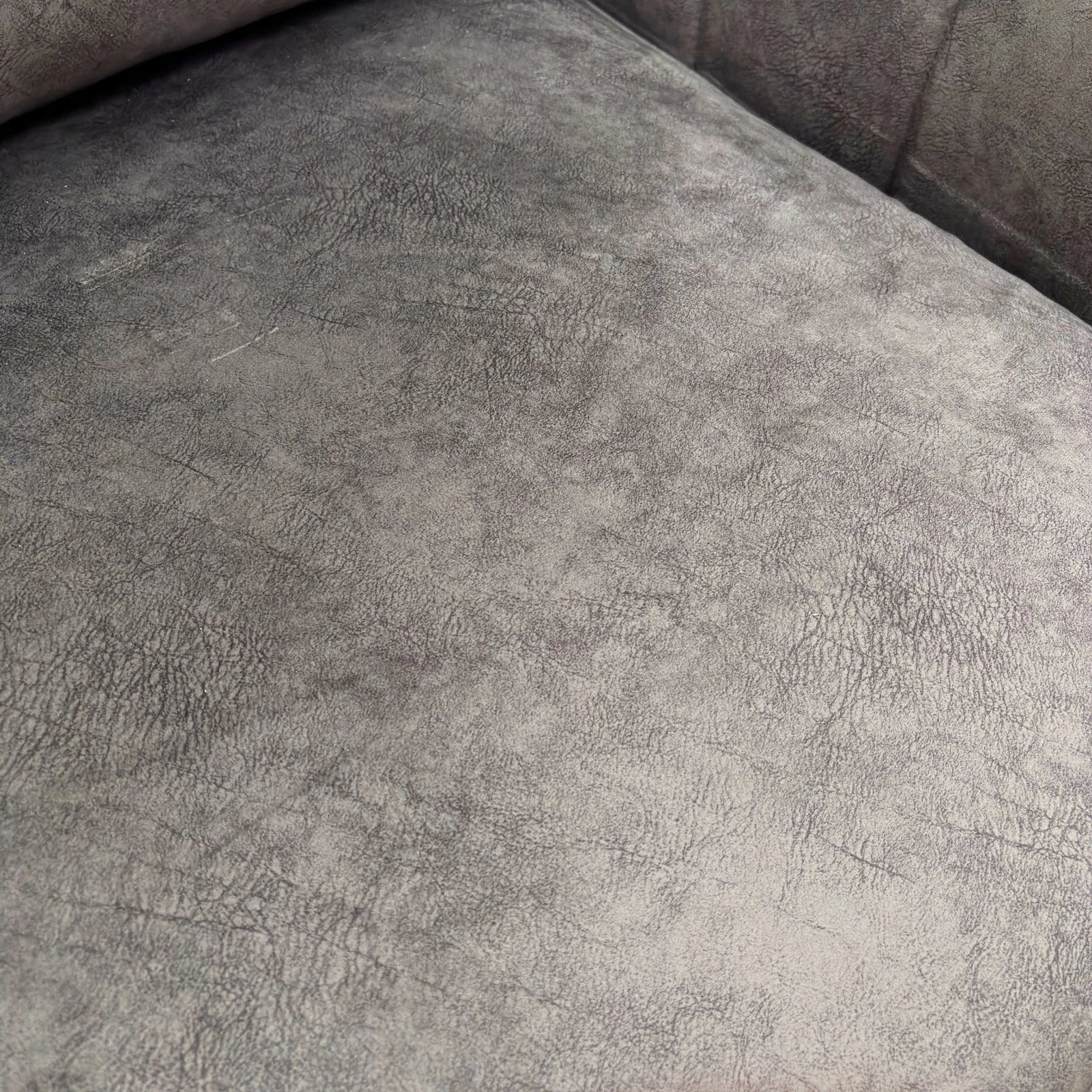 Closer front view of the chair, highlighting the wide seat, plump cushions, and the high-impact Mink velvet fabric texture.