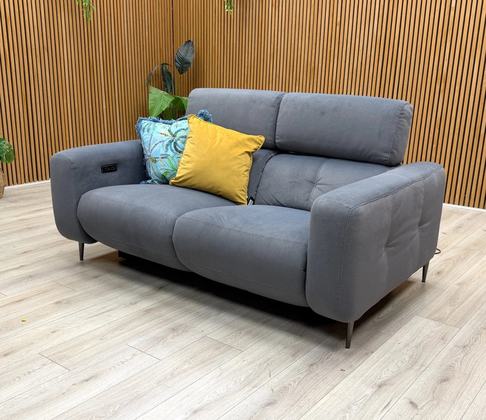Side view of the 'Ezra' power recliner sofa, demonstrating the smooth reclining mechanism and supportive cushioning for ultimate comfort.