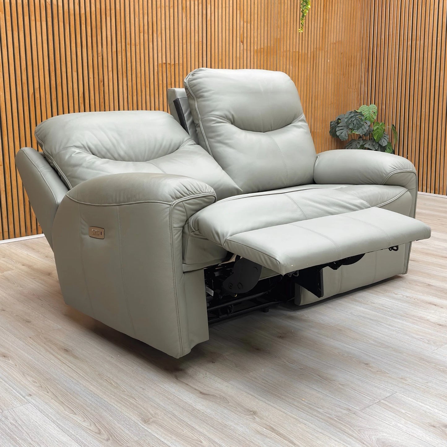 Lifestyle shot of the Amesbury olive leather sofa, highlighting the premium leather finish and high-back design.