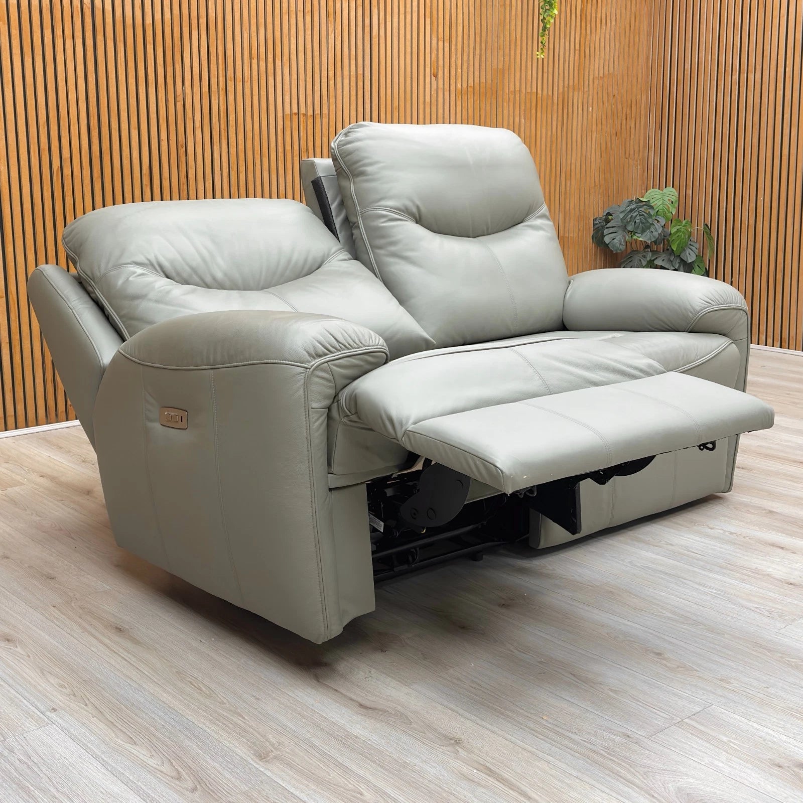 Lifestyle shot of the Amesbury olive leather sofa, highlighting the premium leather finish and high-back design.