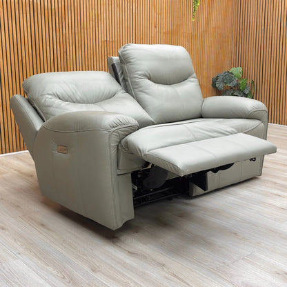 Lifestyle shot of the Amesbury olive leather sofa, highlighting the premium leather finish and high-back design.
