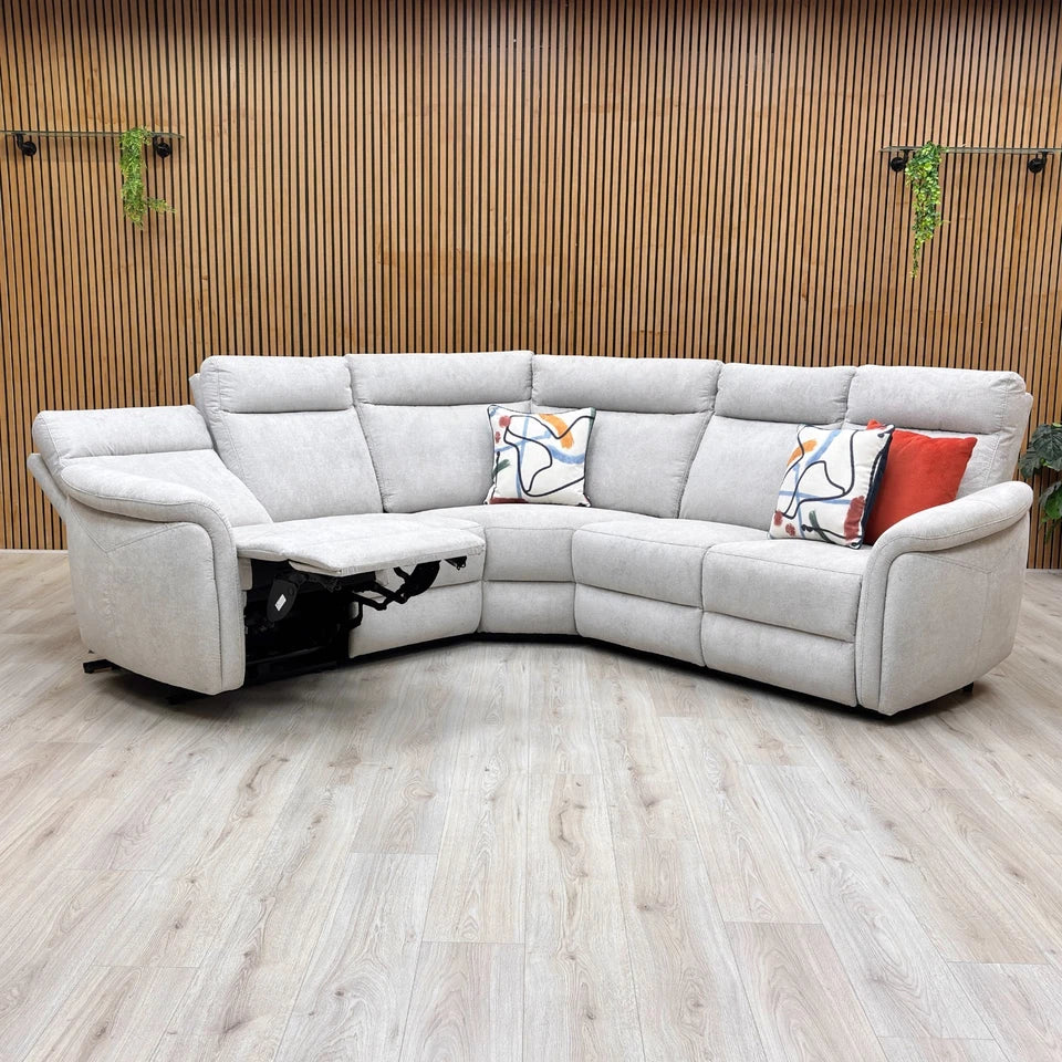 Lifestyle shot of the Dublin corner sofa in a modern living room, highlighting its premium fabric and grey tones.