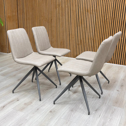 Full-view close-up of a single ‘Isaac’ Taupe Faux Leather Dining Chair, showcasing the smooth upholstery and slim metal legs.