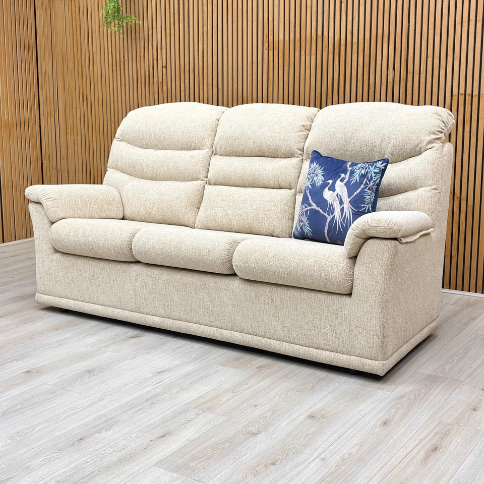 Lifestyle shot highlighting the Malvern's classic high-back design and padded scroll arms.