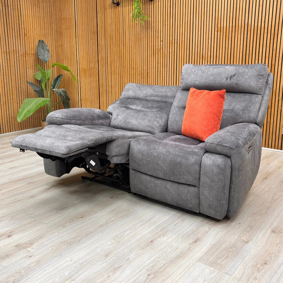 Angled view highlighting the body-hugging design and luxurious, fixed pocket spring seat cushions.