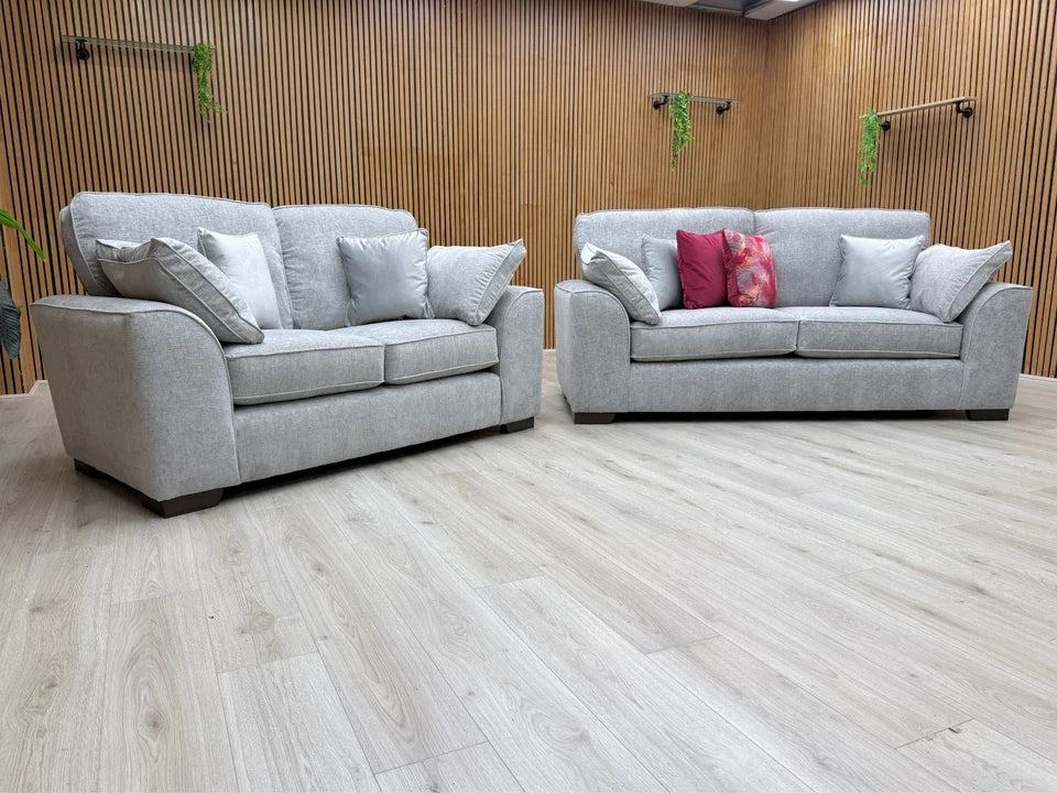 Side view of the 'Harvey' sofa, showing the profile, block feet, and the construction of the seat and back cushions.