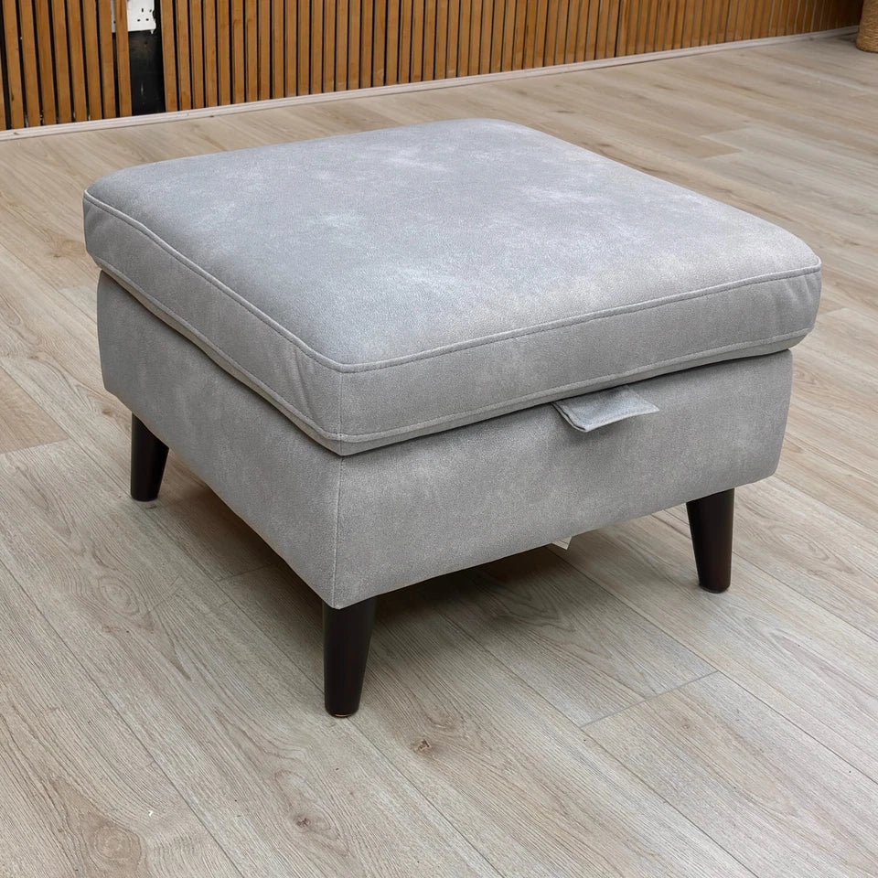 A high-quality photo of the footstool, potentially with other furniture, emphasizing its size and color in a staged setting.