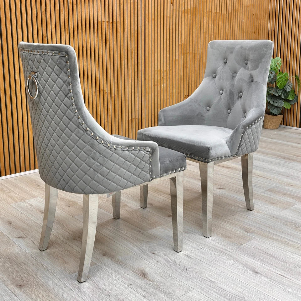Profile view of a single 'Dolce' Silver Velvet dining chair, showcasing the metal legs and overall curved shape.