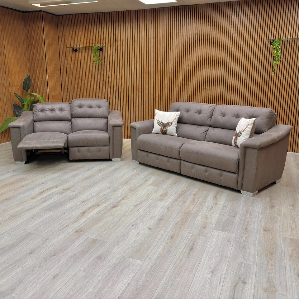 The 2 Seater Manual Recliner Sofa from the La-Z-Boy New Hollywood set, with both end seats fully extended in a deep reclined position, situated within a modern room featuring wooden flooring and contemporary decor.