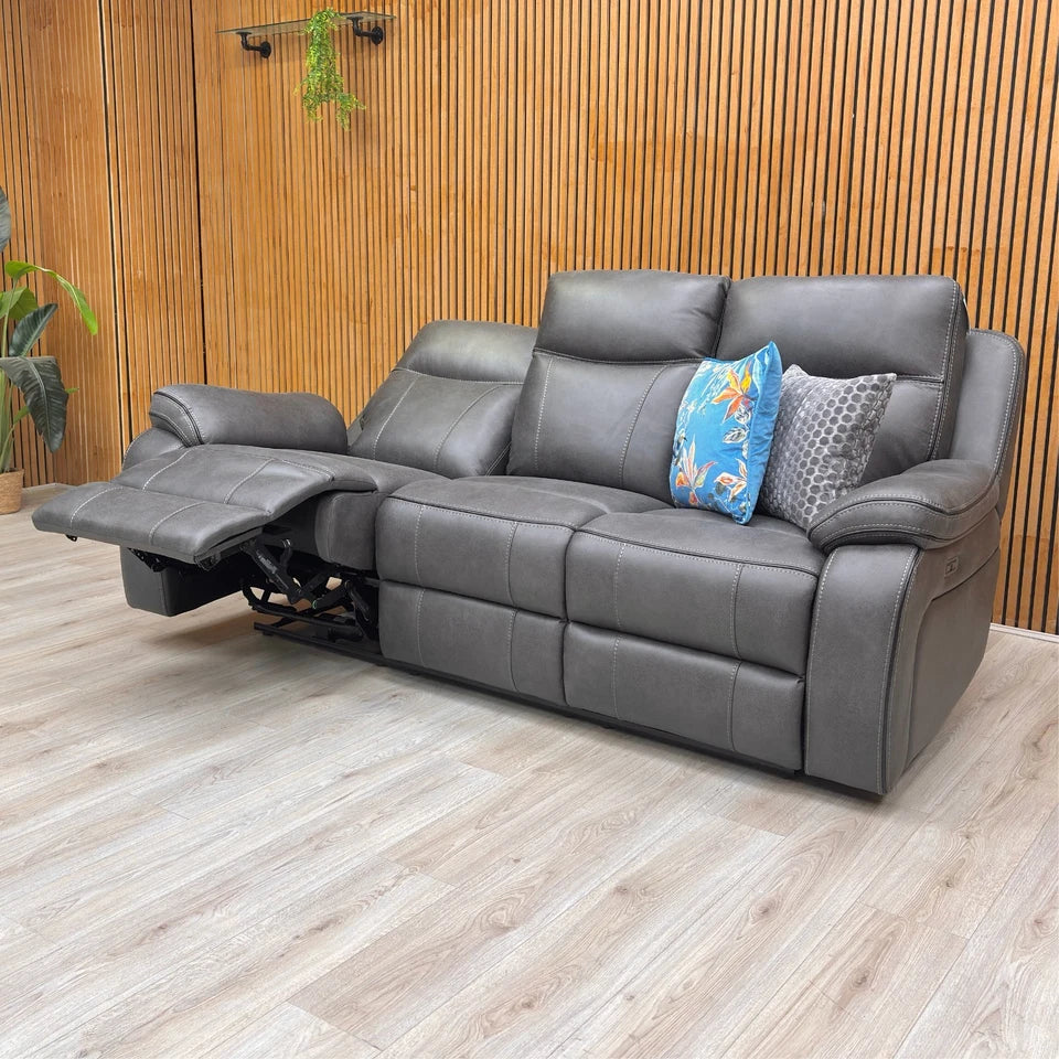 Lifestyle image of the 'Vinson' Graphite Grey Power Recliner Sofa in a modern living room setting.