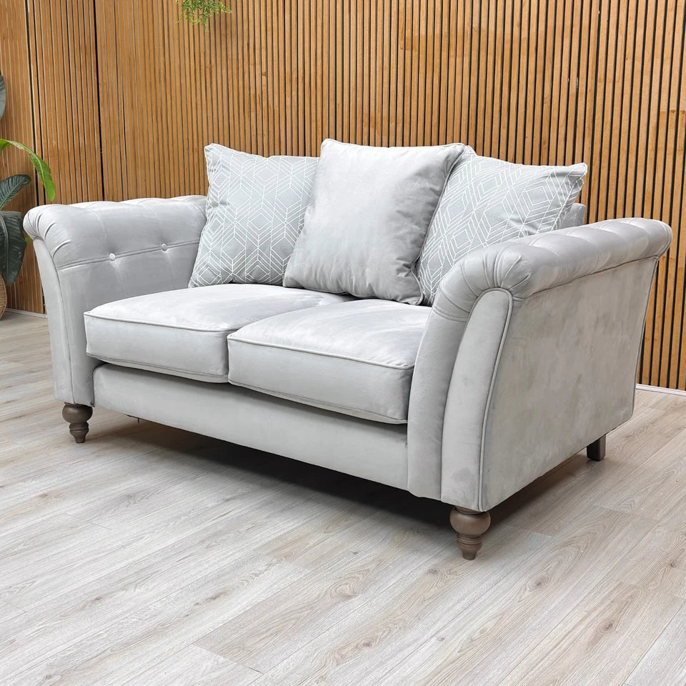 Lifestyle shot of the ‘Milton' Plush Silver Sensual Velvet Scatter Back 2 Seater Sofa.