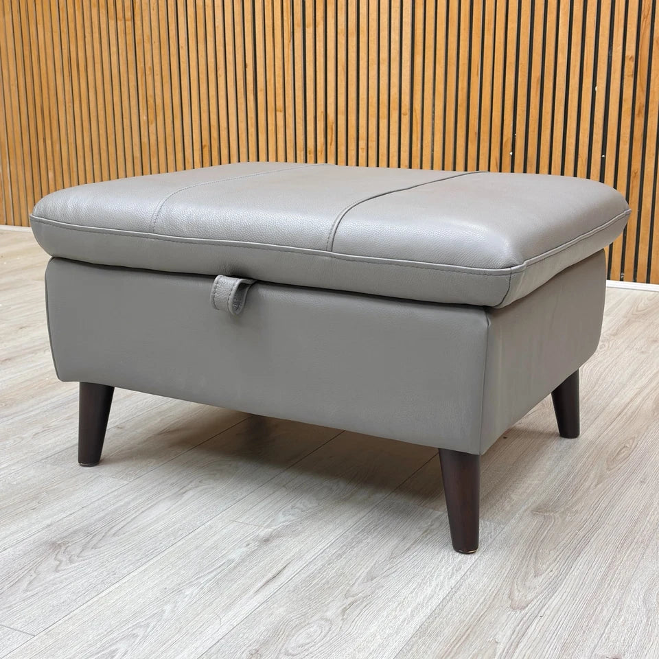 Lifestyle view of the Winner Oslo Footstool, highlighting its luxurious leather and dual function.
