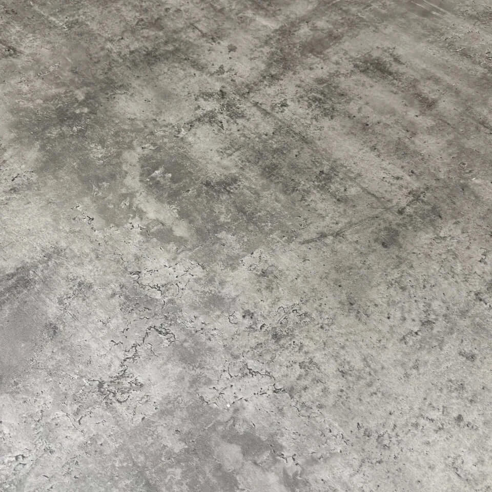 Close-up of a textured gray concrete surface of a Dining table