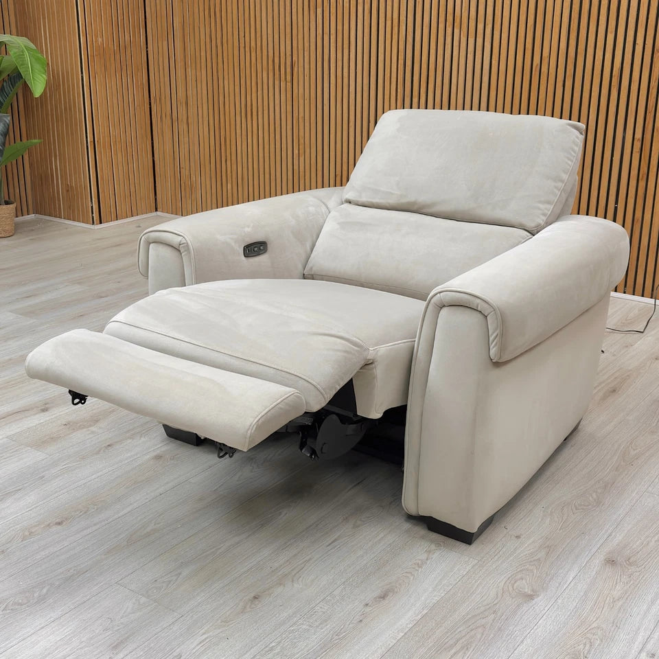 A side or angled view showing the recliner in a fully or partially reclined position, highlighting the footrest extended.