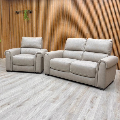 Full view of the Nixon Armchair in Marble Taupe Suede, showing its wide seat and high, supportive back.