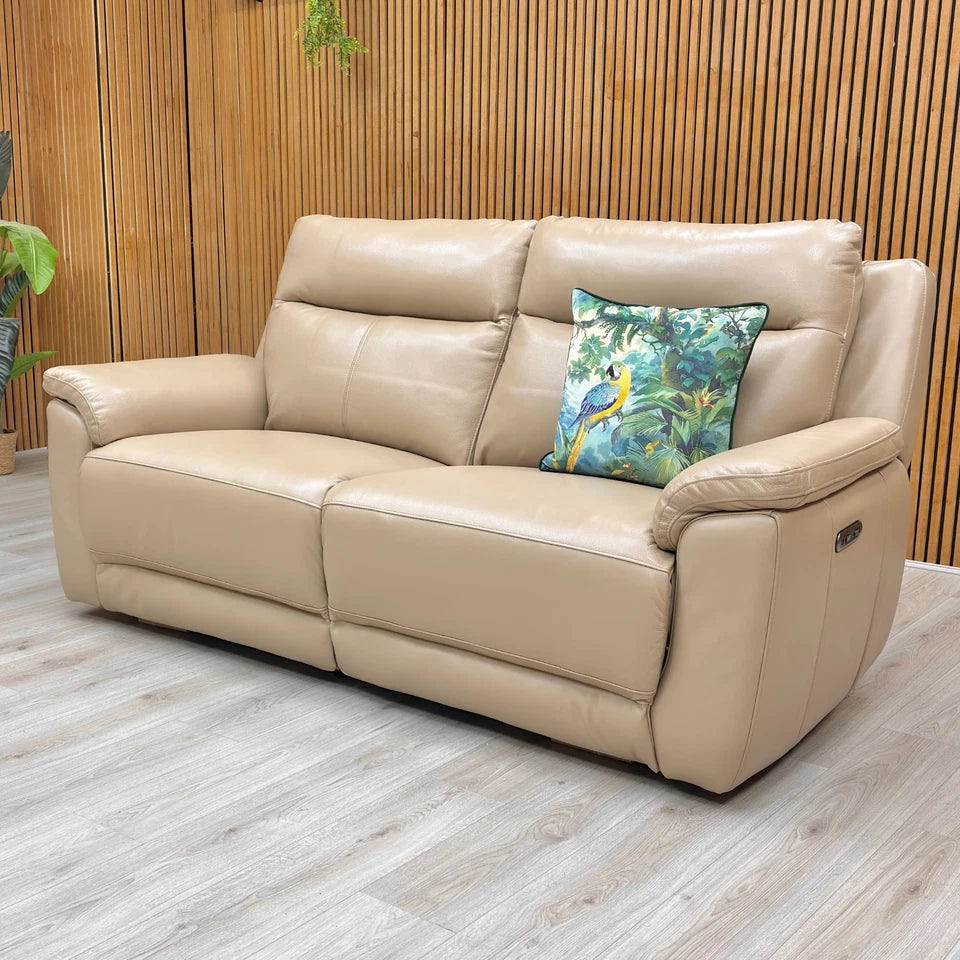 Lifestyle image of the 'Bobby' Cream Leather 3 Seater Sofa, showcasing its high-back, contemporary design.