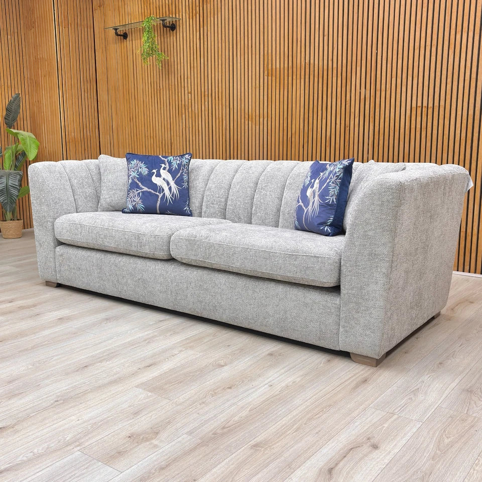 Side profile of the 'Downtown' 4 Seater Sofa, illustrating the sloped arm and frame structure.
