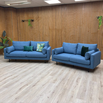 Angled view of the ‘Wren’ 3-Seater Sofa, highlighting the tailored look, sloped arms, and back cushion detailing.