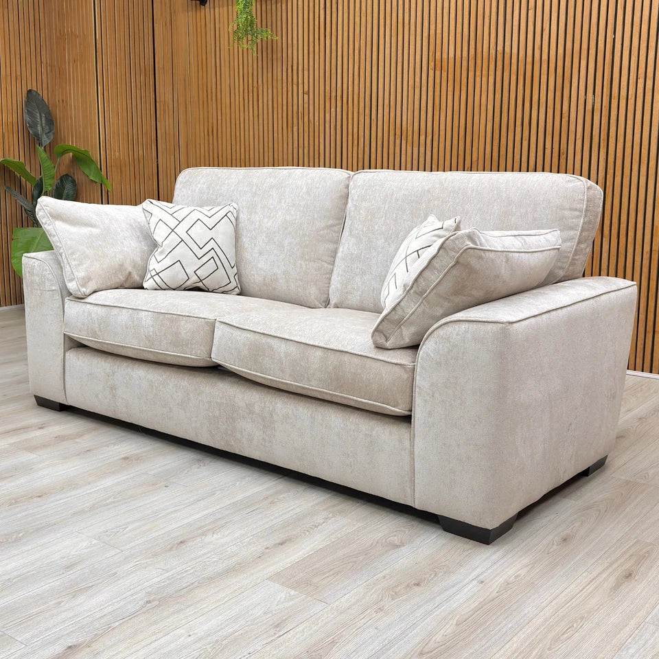 Side angle of the Harvey Truffle 3-seater sofa, showcasing its large seating area and elegant soft weave texture.
