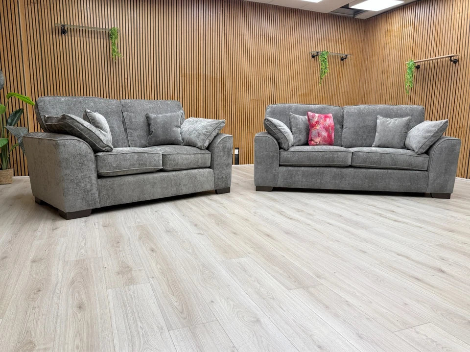 Side view of the 'Harvey' sofa, highlighting the profile, block feet, and the construction of the seat and back cushions.