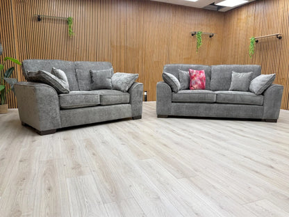 Side view of the 'Harvey' sofa, highlighting the profile, block feet, and the construction of the seat and back cushions.