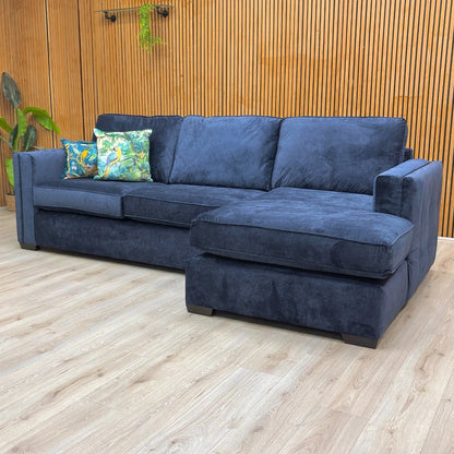 Lifestyle of the sofa, showcasing the 98cm height and the sturdy wooden legs.