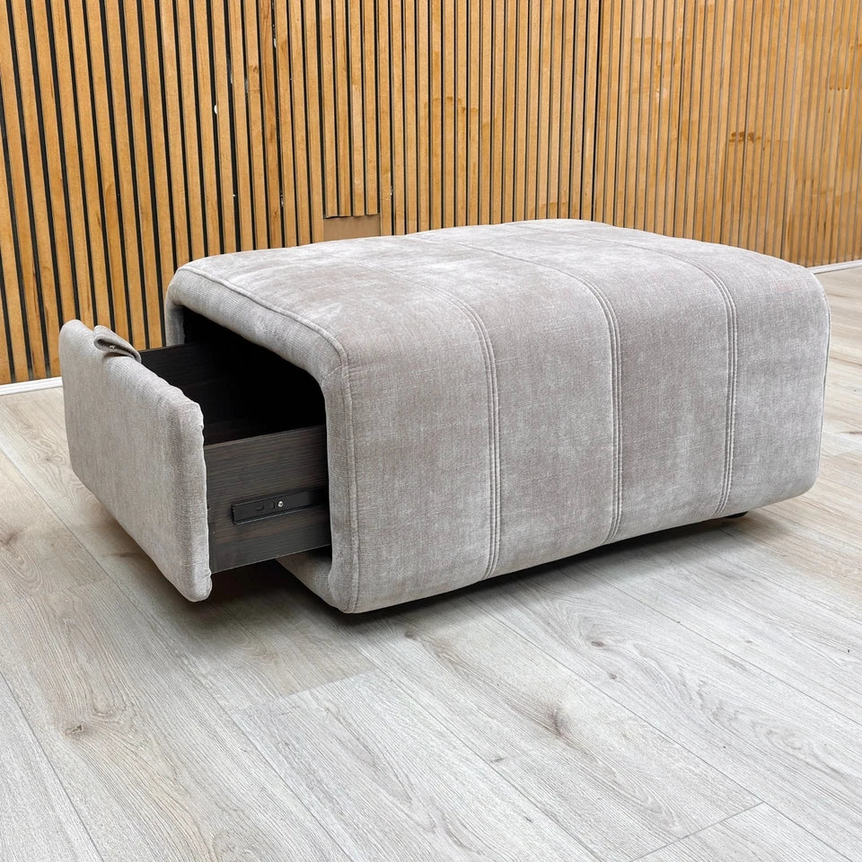 Lifestyle image of the nutmeg fabric footstool in a contemporary living room setting.