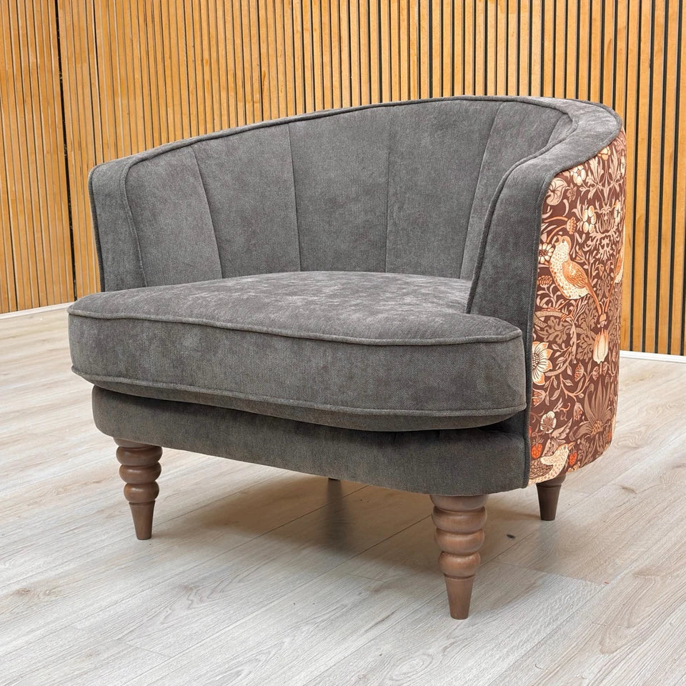 Back view of the Talon armchair, highlighting the beautiful floral pattern upholstery that adds a decorative touch to the design.