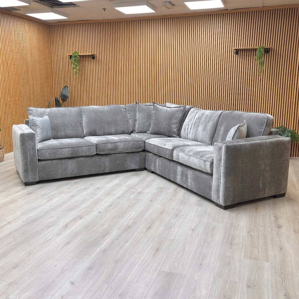 A "lifestyle" shot of the sofa in a living room setting, demonstrating its scale and 5-6 person seating capacity.