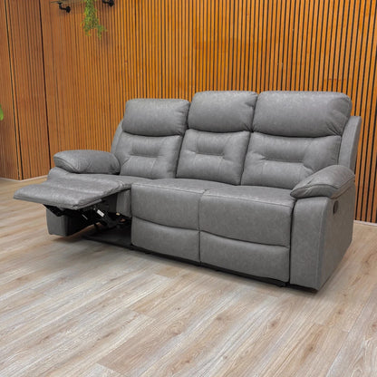 Angled view of the grey fabric 'Beaumont' sofa, highlighting the generous seating area and plush pad arms.