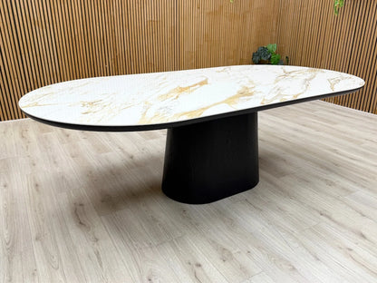 Close-up texture detail of the smooth, glossy white ceramic tabletop with a realistic grey marble-effect pattern.