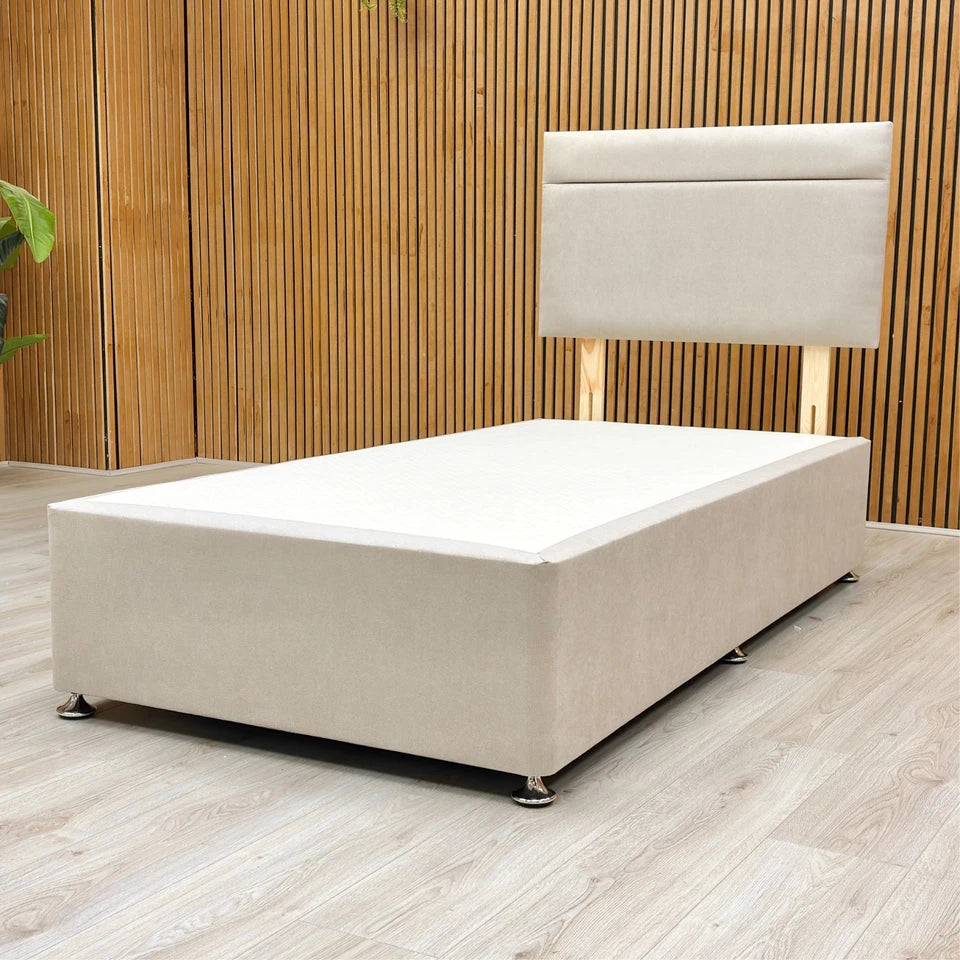 Lifestyle shot of the bed with a mattress and bedding.