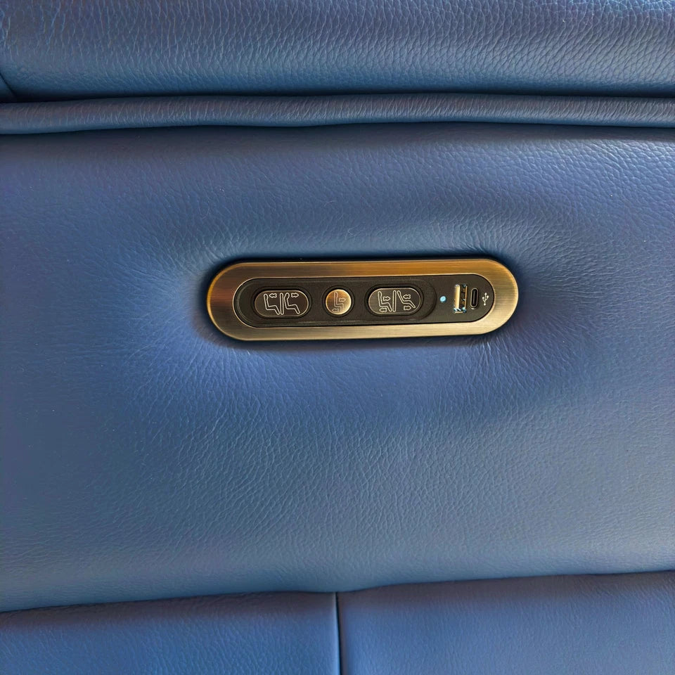 Close-up of the power control panel and USB charging port on the armrest of the 'Inca' Leather Recliner.