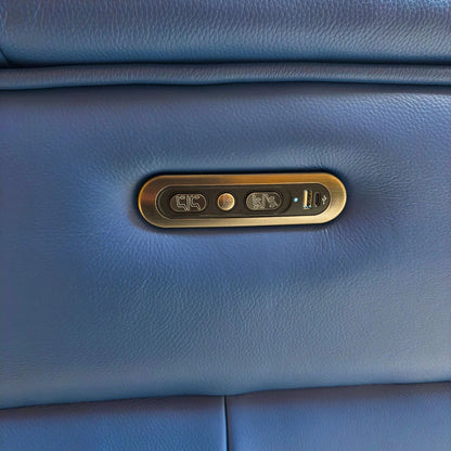 Close-up of the power control panel and USB charging port on the armrest of the 'Inca' Leather Recliner.
