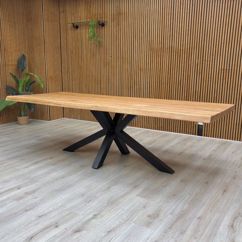 View of the 260 cm dining table with chairs placed around it, illustrating the large scale and seating capacity of the piece.