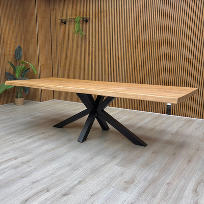 View of the 260 cm dining table with chairs placed around it, illustrating the large scale and seating capacity of the piece.