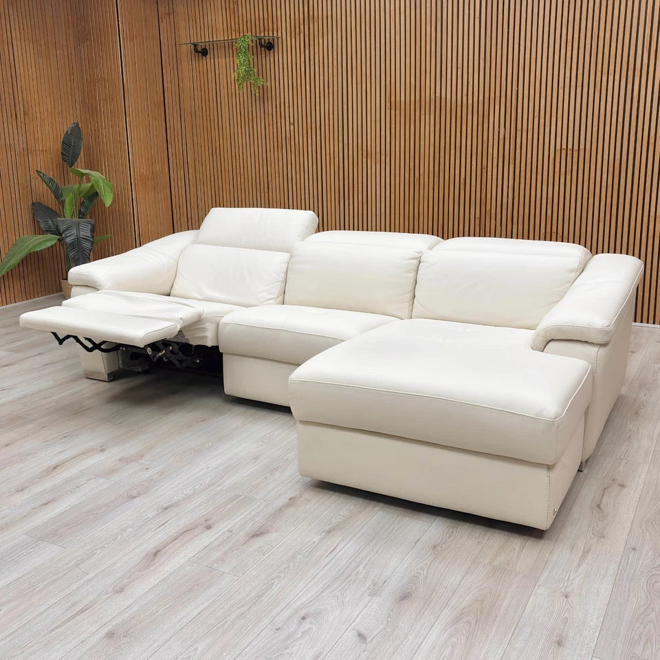 Lifestyle Image of The Nicoletti Galileo power recliner fully extended, showing the comfortable footrest and adjustable power headrest.