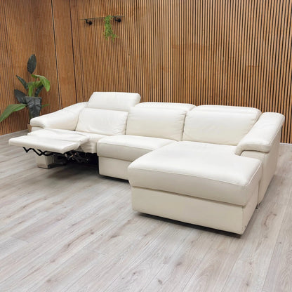 Lifestyle Image of The Nicoletti Galileo power recliner fully extended, showing the comfortable footrest and adjustable power headrest.