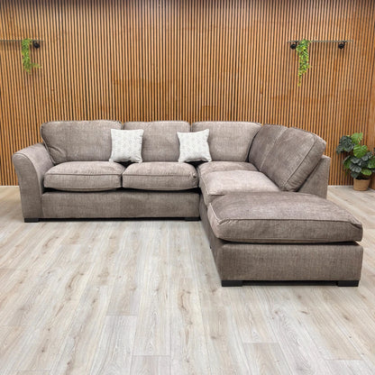 Lifestyle shot of the ‘Rosie’ Stone Grey Vogue Velvet Corner Sofa.