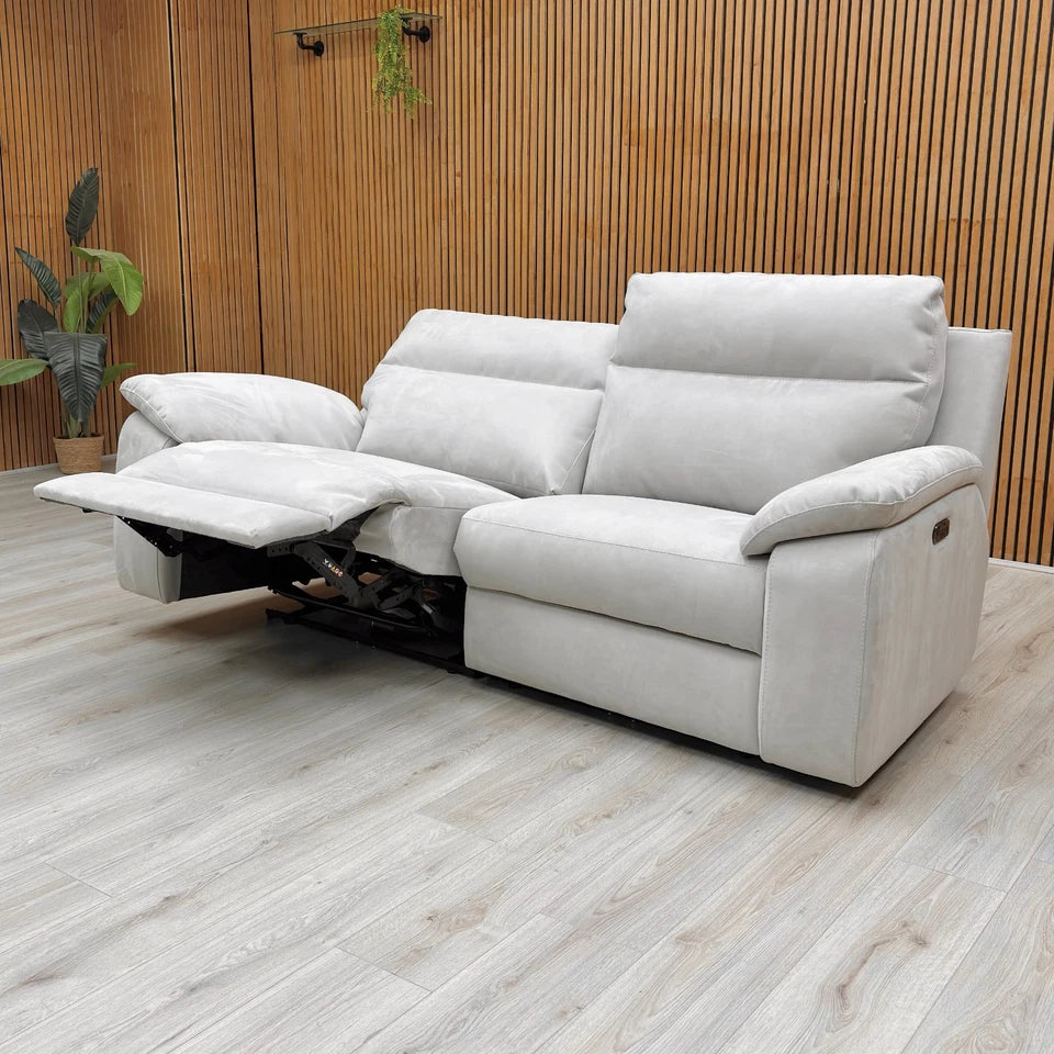 The Nicoletti Pepino 3 Seater Sofa with the two end seats fully extended in the deep power recline position in Moderm Room Setting.