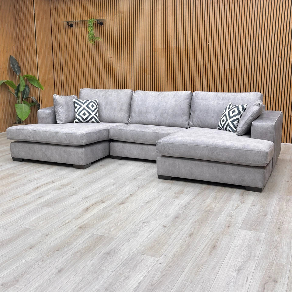 Lifestyle shot of the sofa, emphasizing the 84cm height and the modern, low-profile wooden frame.