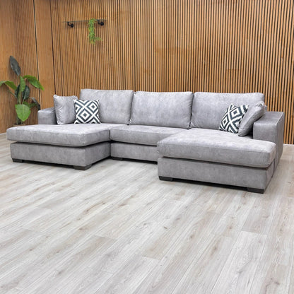 Lifestyle shot of the sofa, emphasizing the 84cm height and the modern, low-profile wooden frame.