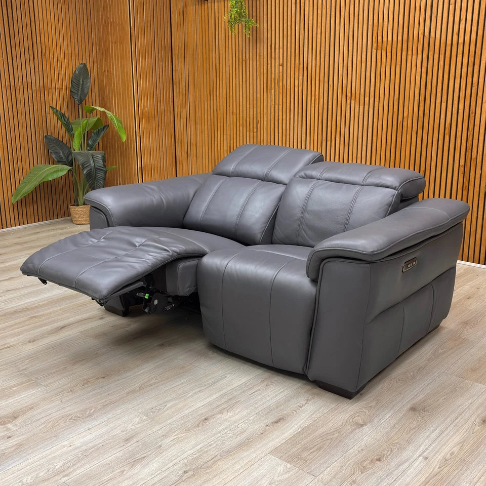 Lifestyle shot of the 'Inca' Sofa, showcasing its contemporary design and power functions.