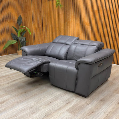 Lifestyle shot of the 'Inca' Sofa, showcasing its contemporary design and power functions.