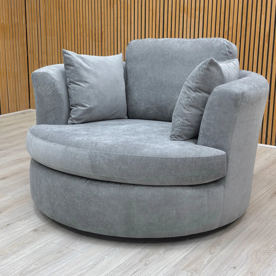 Side profile of the Freya Swivel Chair showing the round back design.