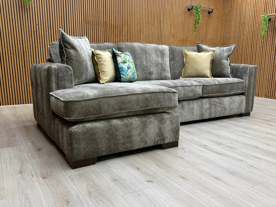 Side-view of the 'Chelsea' Left Hand Corner Chaise Sofa, showing the low-profile track arm and the wooden block feet.