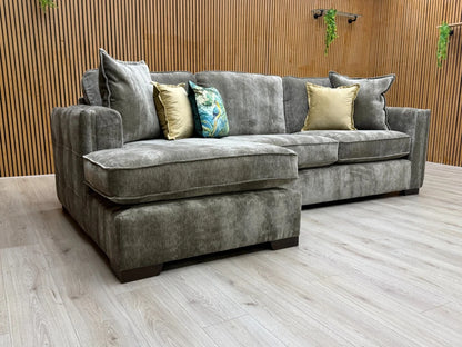 Side-view of the 'Chelsea' Left Hand Corner Chaise Sofa, showing the low-profile track arm and the wooden block feet.