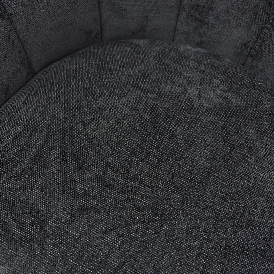 Close-up shot of the back of the chair, focusing on the texture and the smooth curve of the backrest.