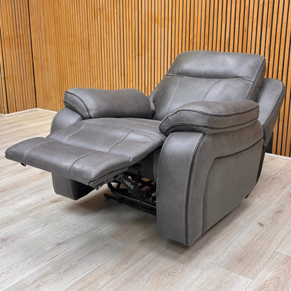 Lifestyle image of the 'Vinson' Graphite Grey Armchair, highlighting its modern style and plush comfort.