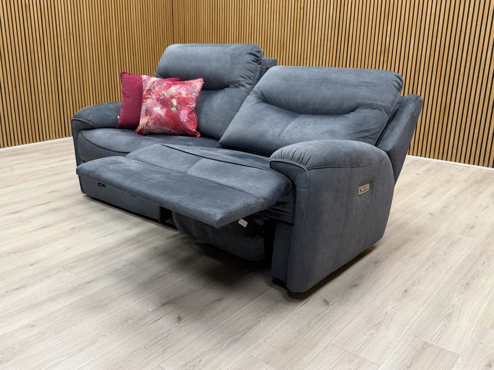 Lifestyle View of the sofa in a partially reclined position with the headrest adjusted for comfort.